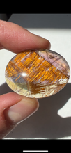 Load image into Gallery viewer, Cacoxenite in Quartz Cabochon with Amethyst
