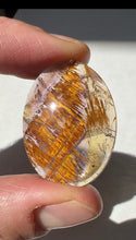 Load image into Gallery viewer, Cacoxenite in Quartz Cabochon with Amethyst
